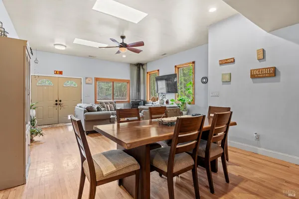 a view of a dining room with furniture window and wooden floor