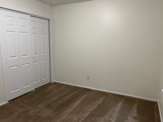 4630 Enchanted Rock Lane Spring, TX 77388 - Photo 13 of 15 an empty room with a wooden cupboard