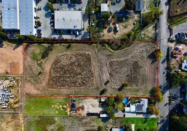 an aerial view of a building with outdoor area