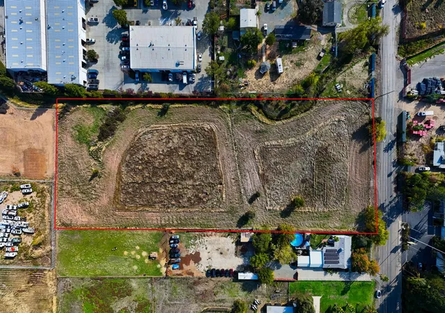 an aerial view of a building with outdoor area