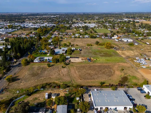 an aerial view of residential house and car parked