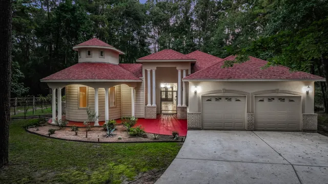 a front view of a house with garden