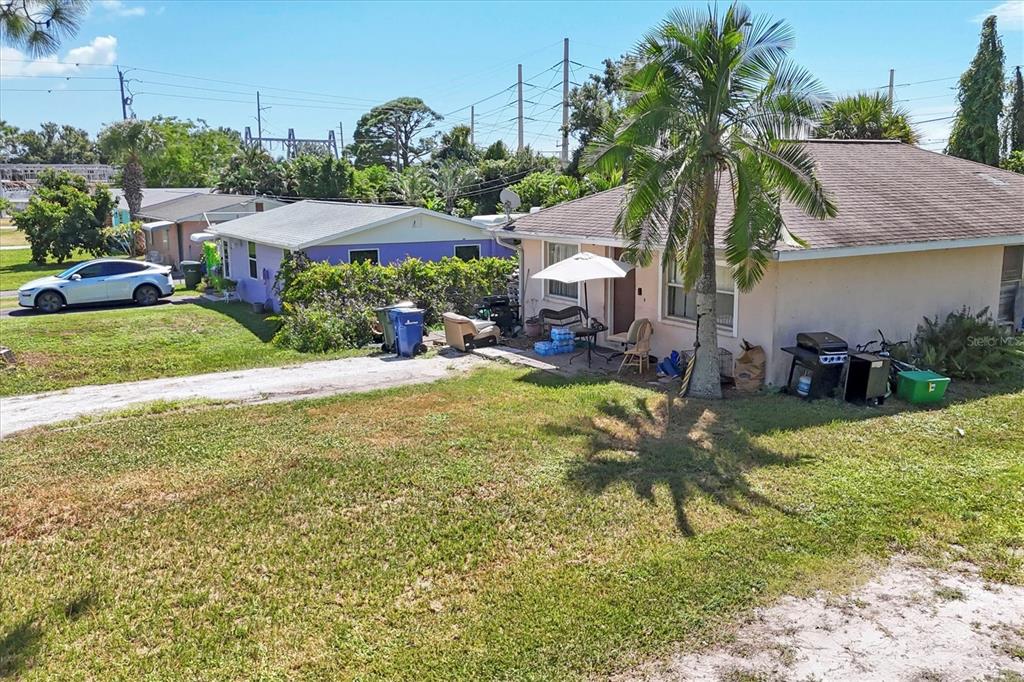 2214 Park Road Venice, FL 34293 - Photo 4 of 10 a view of a house with garden and a bench