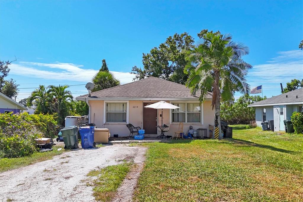 2214 Park Road Venice, FL 34293 - Photo 5 of 10 a front view of a house with garden