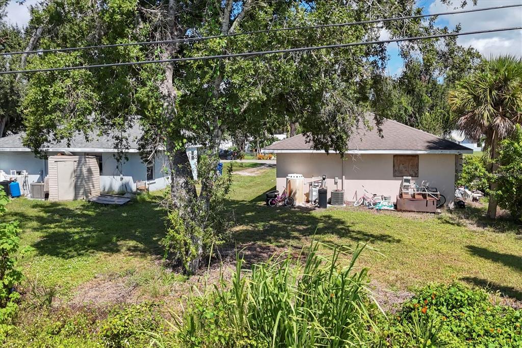 2214 Park Road Venice, FL 34293 - Photo 8 of 10 a view of a house with a yard and sitting area