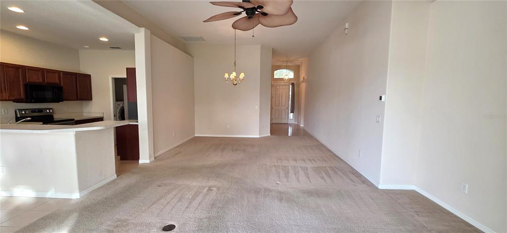 10906 Tree Cactus Loop Land O Lakes, FL 34638 - Photo 15 of 62 a view of a livingroom with a flat screen tv