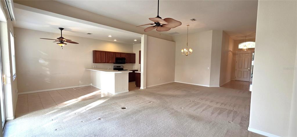 10906 Tree Cactus Loop Land O Lakes, FL 34638 - Photo 16 of 62 a view of a livingroom with a flat screen tv