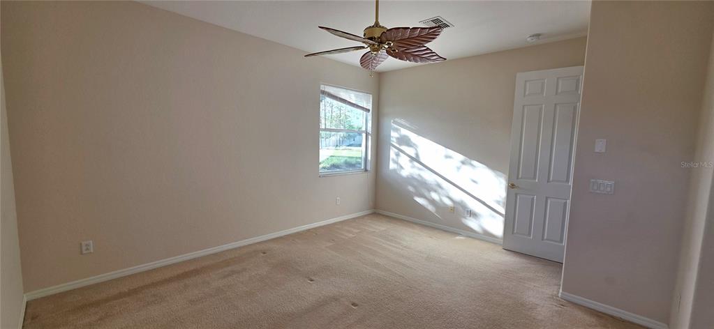 10906 Tree Cactus Loop Land O Lakes, FL 34638 - Photo 29 of 62 a view of an empty room with a window