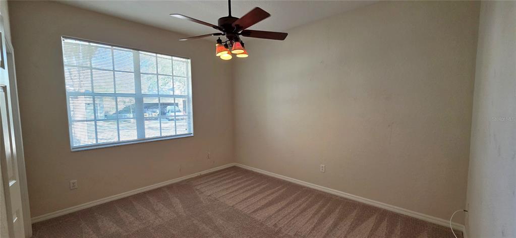 10906 Tree Cactus Loop Land O Lakes, FL 34638 - Photo 38 of 62 an empty room with a window