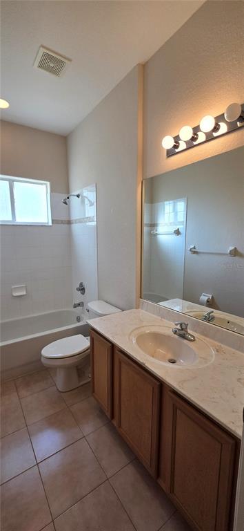 10906 Tree Cactus Loop Land O Lakes, FL 34638 - Photo 44 of 62 a bathroom with a granite countertop sink and a mirror