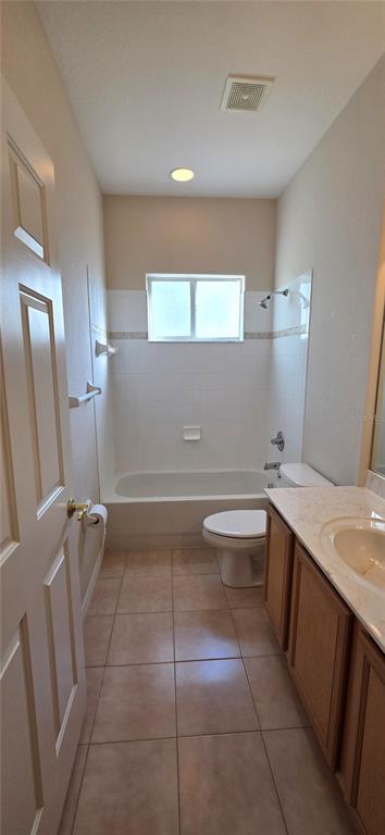 10906 Tree Cactus Loop Land O Lakes, FL 34638 - Photo 45 of 62 a bathroom with a sink a toilet and mirror