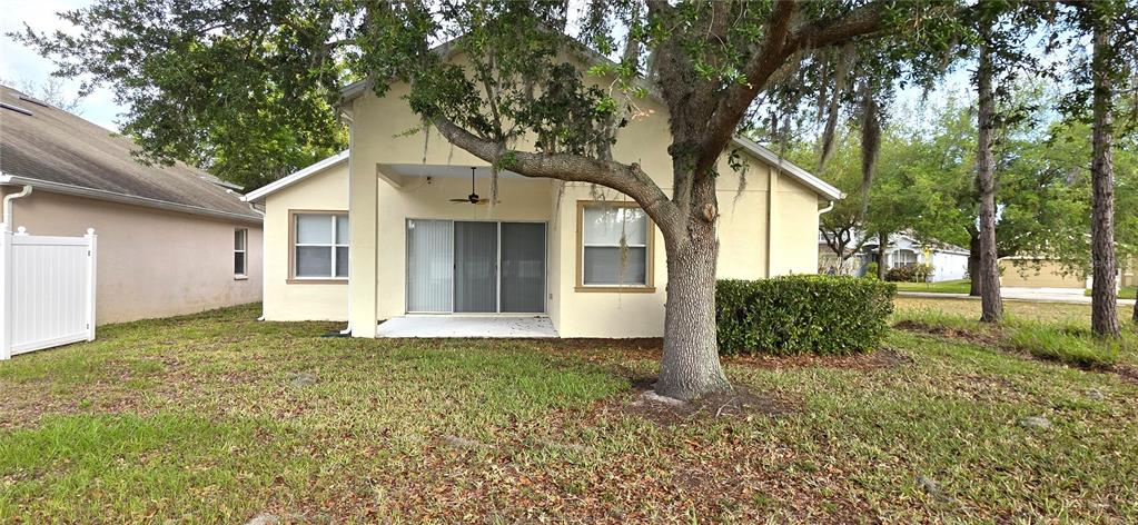 10906 Tree Cactus Loop Land O Lakes, FL 34638 - Photo 53 of 62 a front view of a house with a yard