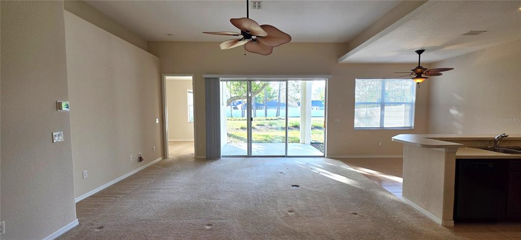 10906 Tree Cactus Loop Land O Lakes, FL 34638 - Photo 10 of 62 a view of an empty room with a window