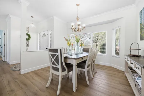 a kitchen with white cabinets stainless steel appliances and sink