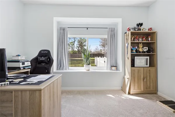 a bedroom with bed and a flat screen tv