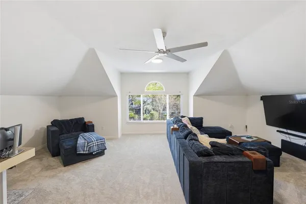 a view of a swimming pool with an outdoor space and seating area