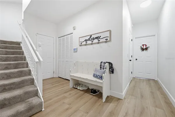 a view of a house with a yard and sitting area