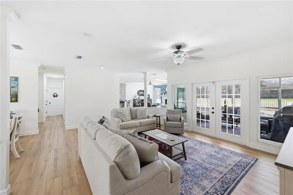 a living room with a fireplace cabinets and a window