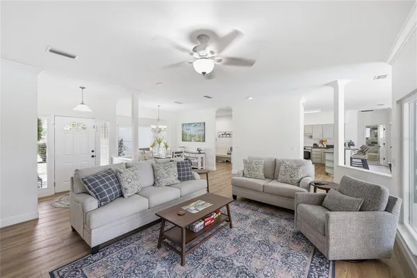 a living room with a fireplace and a rug