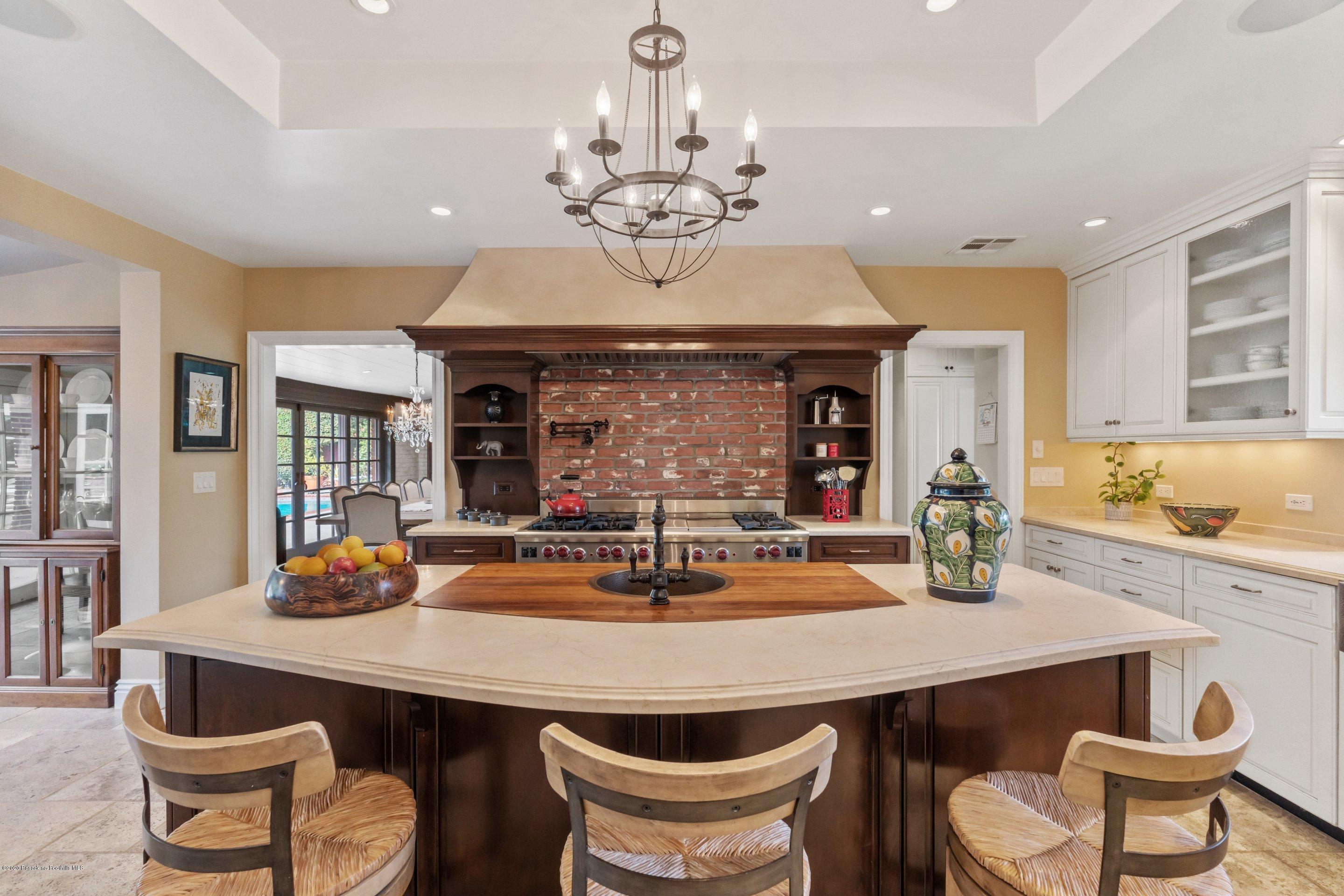 3393 Lombardy Road Pasadena, CA 91107 - Photo 14 of 50 a dining room with a table and chairs