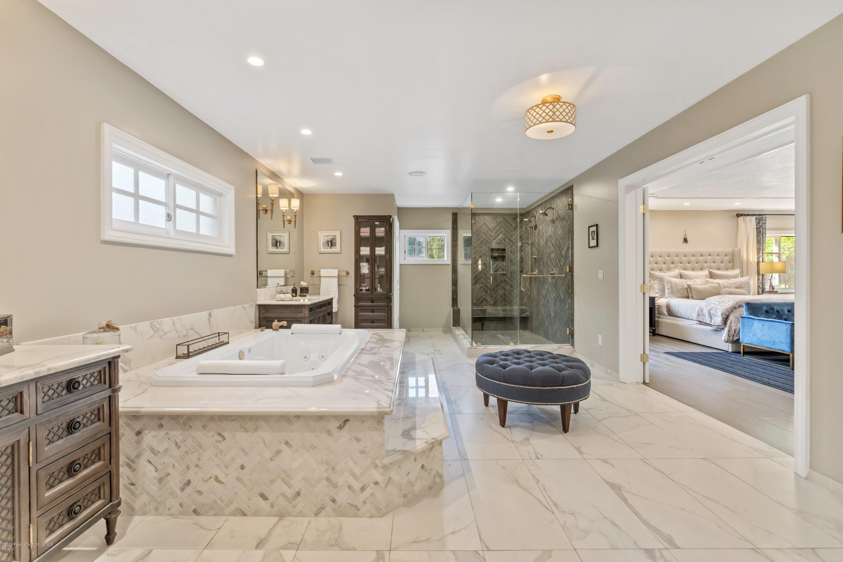 3393 Lombardy Road Pasadena, CA 91107 - Photo 22 of 50 a bathroom with a granite countertop sink a toilet and shower