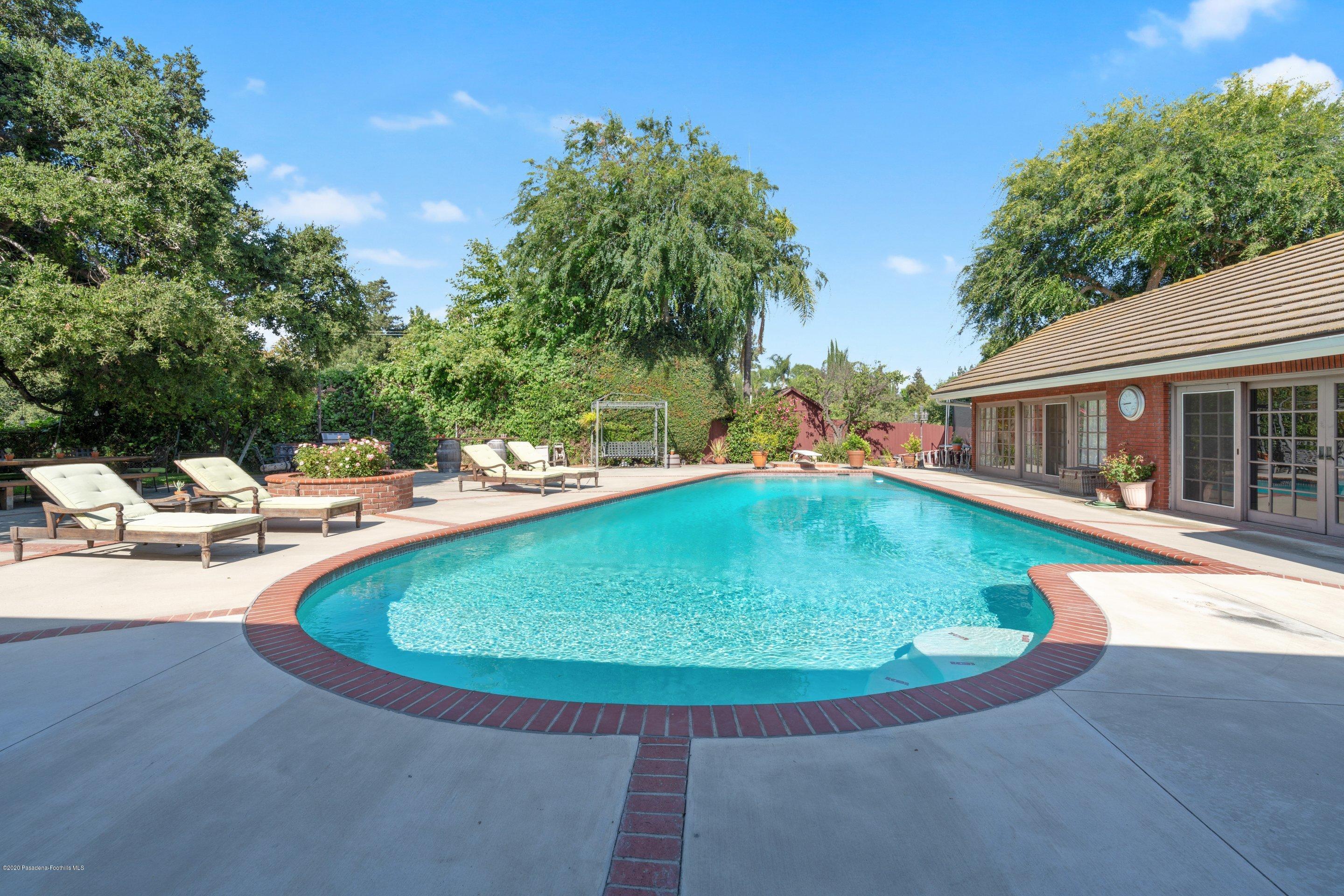 3393 Lombardy Road Pasadena, CA 91107 - Photo 50 of 50 a view of a swimming pool with chairs