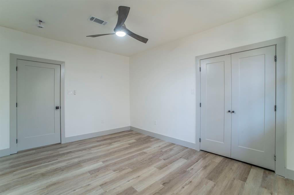 5914 Victor Street Dallas, TX 75214 - Photo 26 of 32 a view of an empty room with wooden floor