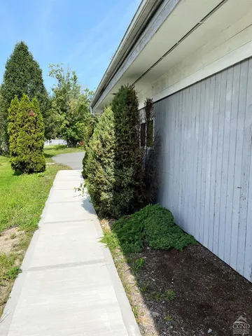 a view of path along with green space