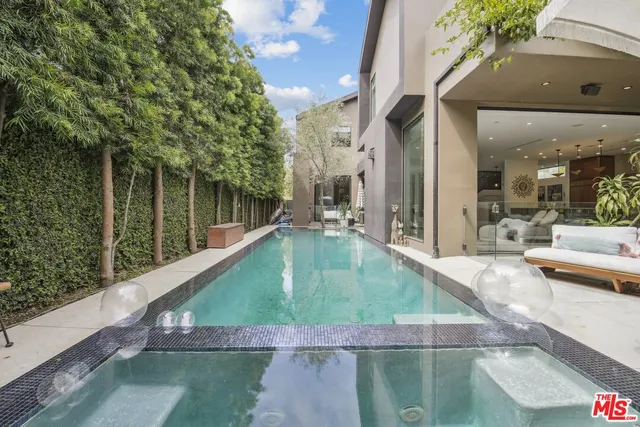 a view of a swimming pool with a patio