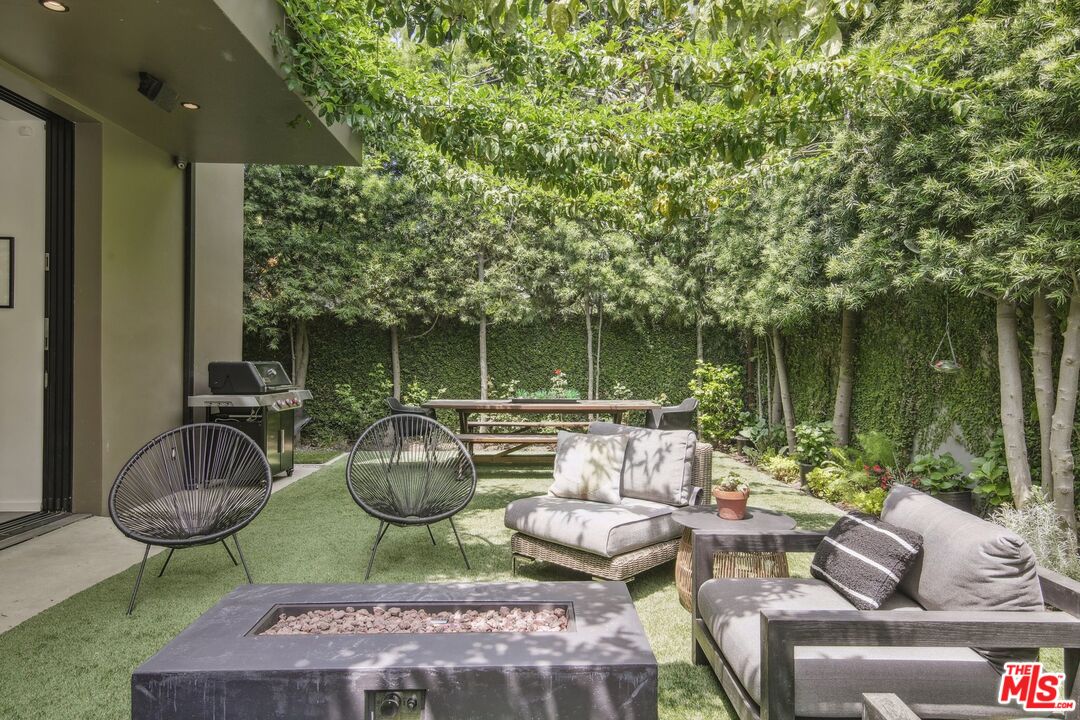 1506 Walnut Avenue Venice, CA 90291 - Photo 25 of 29 a view of a patio with couches chairs and a potted plant