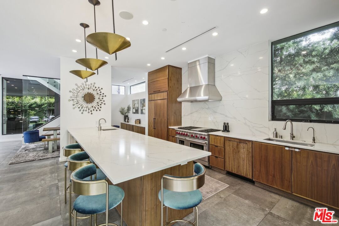 1506 Walnut Avenue Venice, CA 90291 - Photo 6 of 29 a kitchen with stainless steel appliances granite countertop a sink a stove and a refrigerator