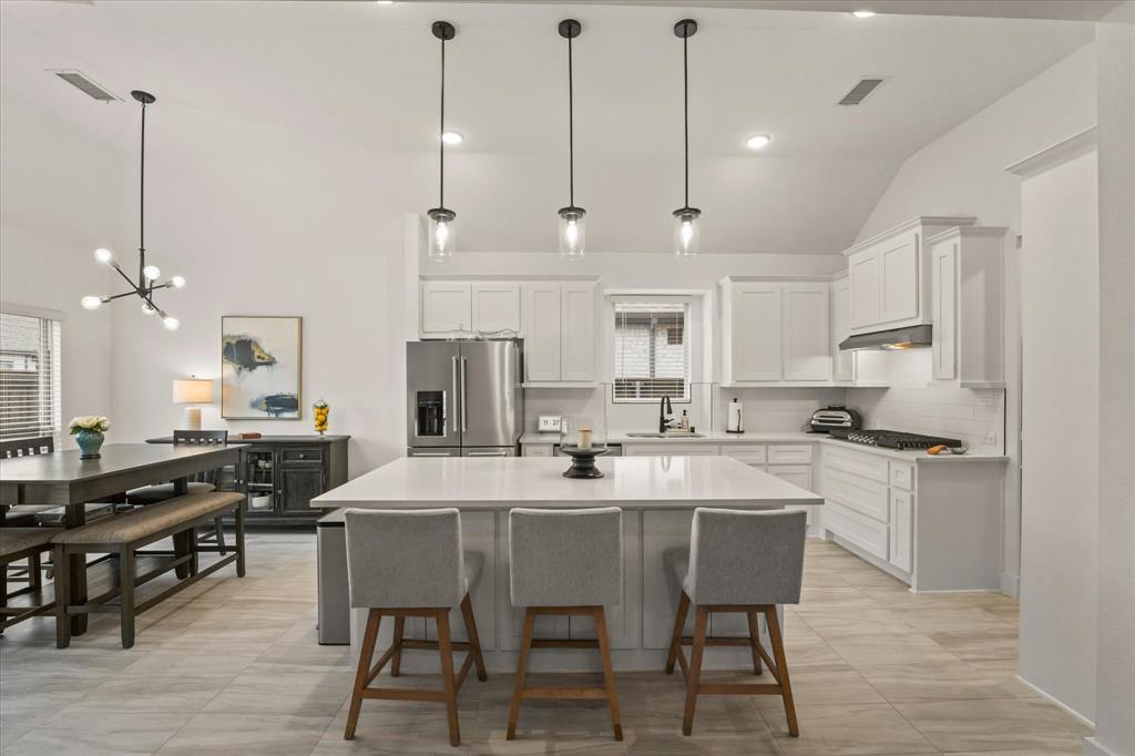 1714 Highwood Road Forney, TX 75126 - Photo 10 of 30 Modern kitchen with white cabinetry and stainless steel appliances
