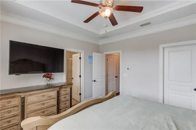 a view of a livingroom with an empty space and a flat screen tv