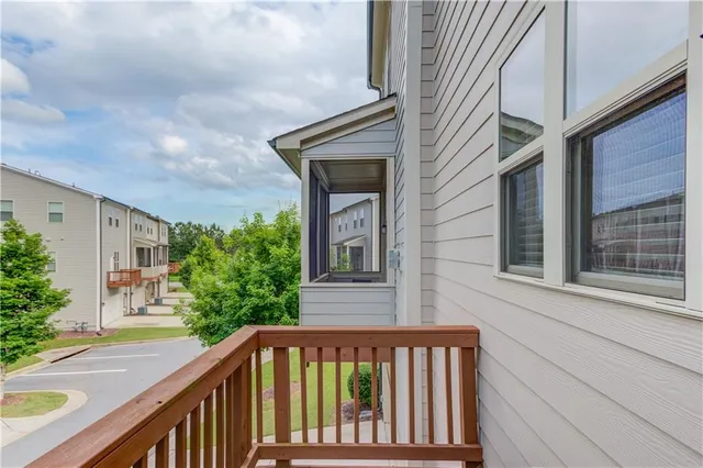 a view of a house with a small yard