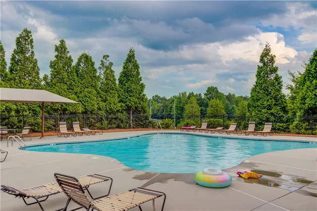 a view of a swimming pool and lounge chair