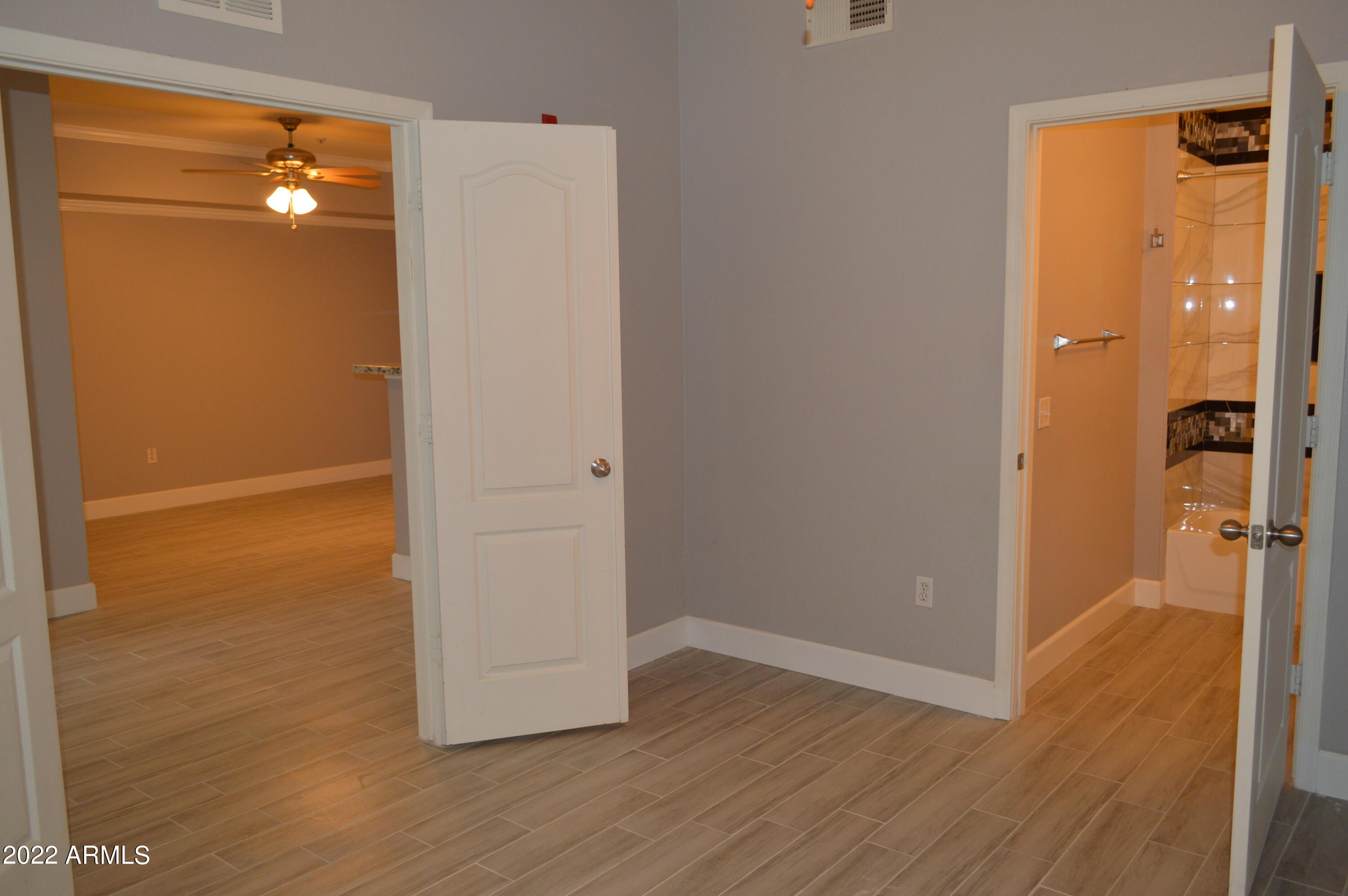 1701 East Colter Street, Unit 184 Phoenix, AZ 85016 - Photo 15 of 51 a view of a hallway with wooden floor