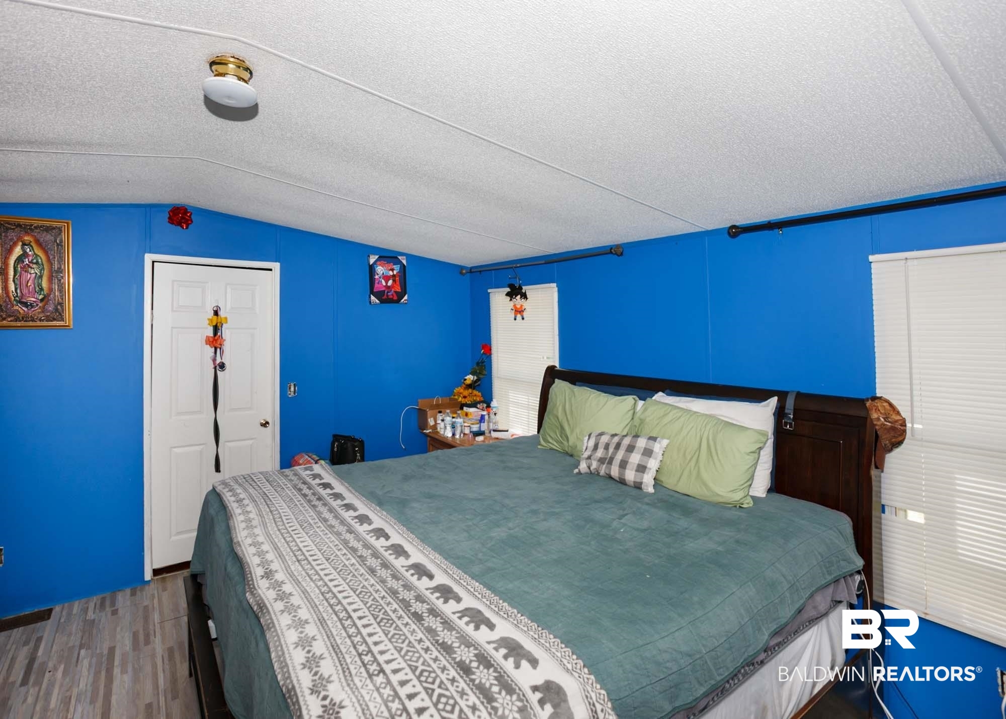 14005 County Road 49 Foley, AL 36535 - Photo 18 of 38 Bedroom featuring wood finished floors, lofted ceiling, and a textured ceiling