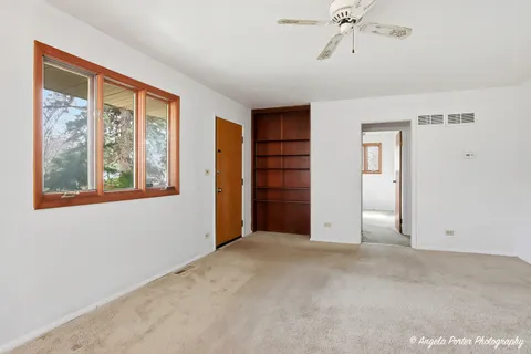 a view of an empty room with a window