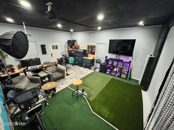 a room with lots of chairs and a projector