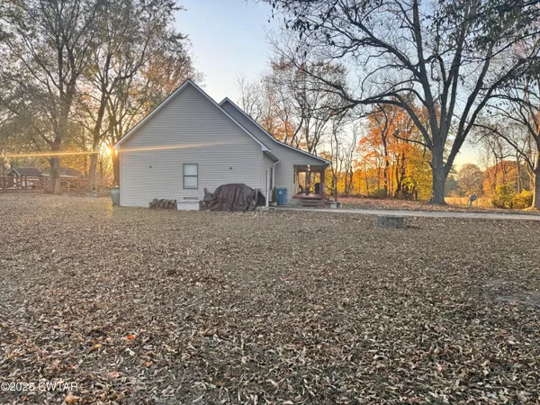 a house with trees in front of it