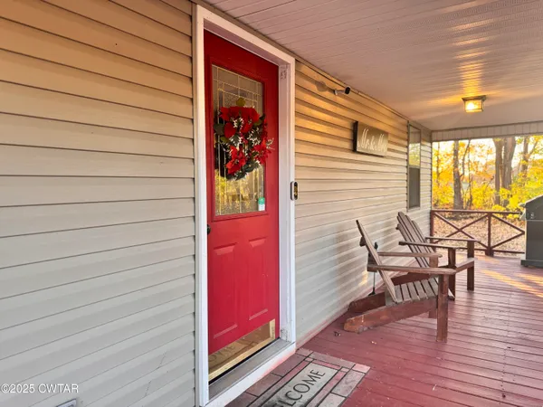 a view of a chairs with a table and chair in balcony