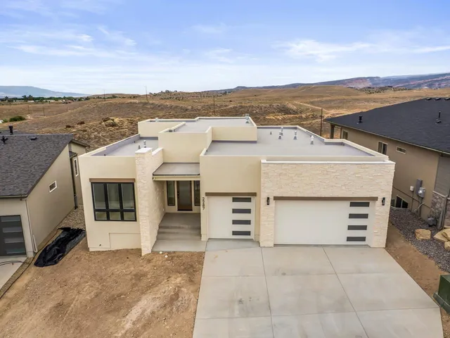 an aerial view of a house with a terrace