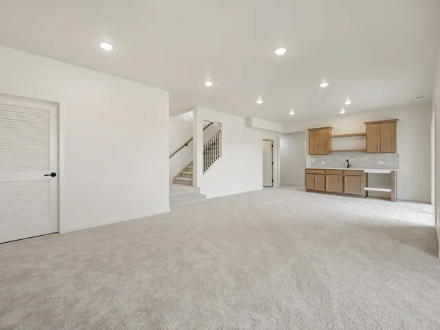 a view of a kitchen with a sink cabinets and a refrigerator