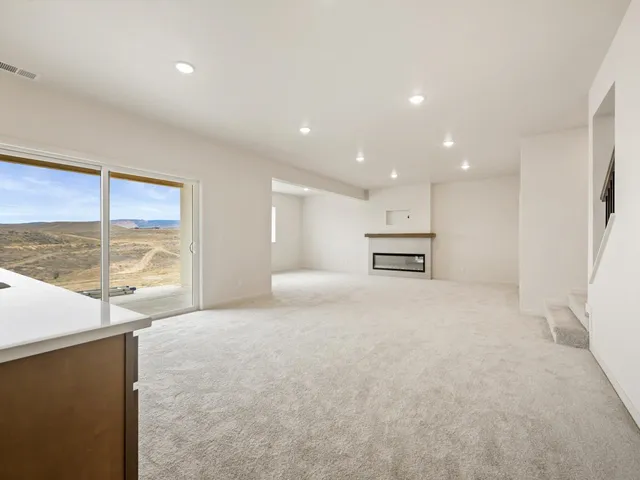 a large bedroom with a large bed and a large window