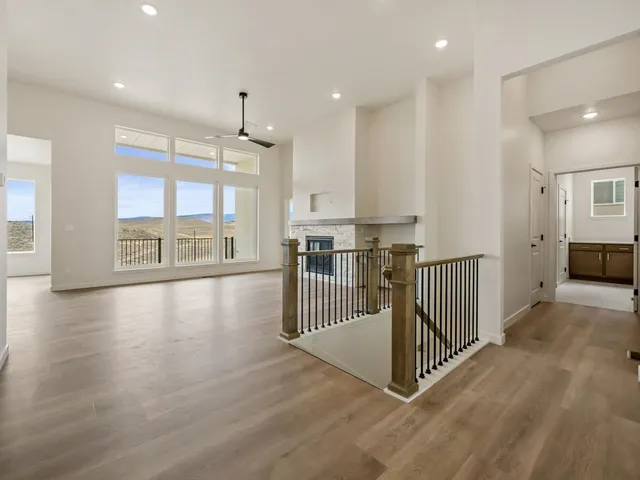 a view of a kitchen with lots of counter top space and windows