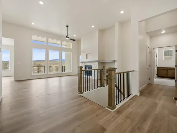a view of a kitchen with lots of counter top space and windows