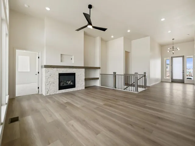 a view of a kitchen with a sink and a fireplace