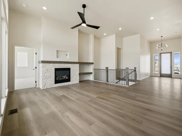 a view of a kitchen with a sink and a fireplace