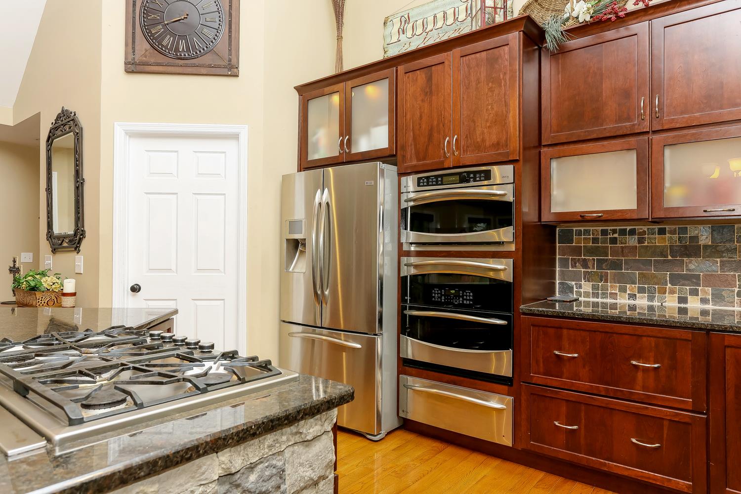 3675 Dobbin Road Springfield, TN 37172 - Photo 8 of 28 a kitchen with wooden cabinets and a stove top oven