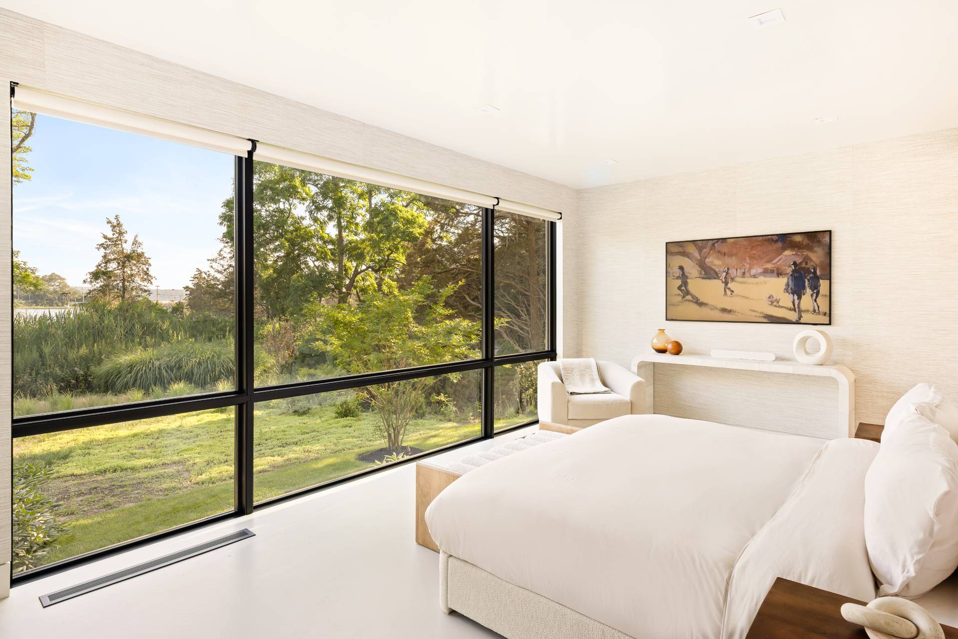 4 3rd Street Sag Harbor, NY 11963 - Photo 17 of 46 a bedroom with a large window and a bed